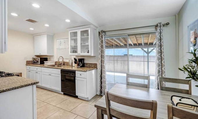 Azusa House | Quaint City Haven: 2-Bedroom Retreat with Free Laundry Access, Private Parking Bliss, and Blazing Internet.