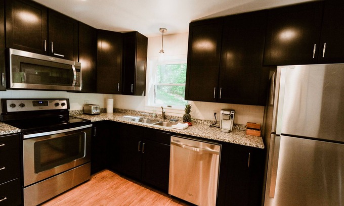 Lake Leelanau Cottage | Quaint cottage ON Lake Leelanau! Dock, deck, fire pit, large lawn!