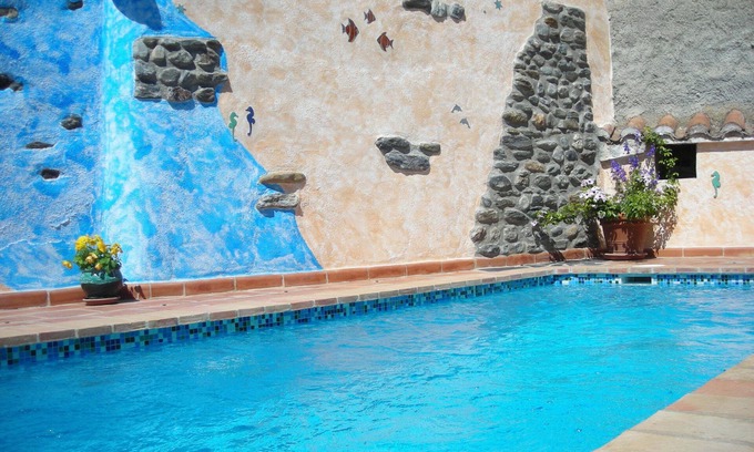 Orgiva House | Quiet village house, central and comfortable with garden and heated pool, garage