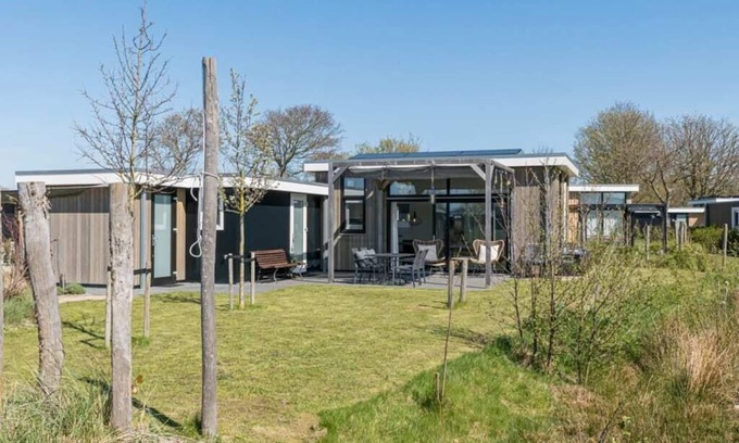 Burgh-Haamstede House | Real music lovers can indulge themselves here, as this chalet has a piano! From the living room you