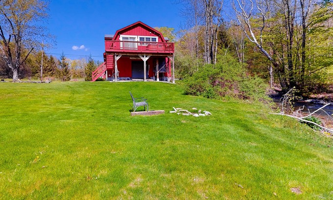 Sandgate Apartment | Red barn retreat with river views, hot tub, deck, firepit, & large yard