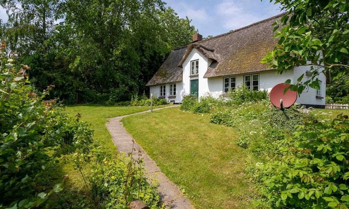 Westerhever Villa | Reetgedecktes Ferienhaus in Westerhever mit Sauna
