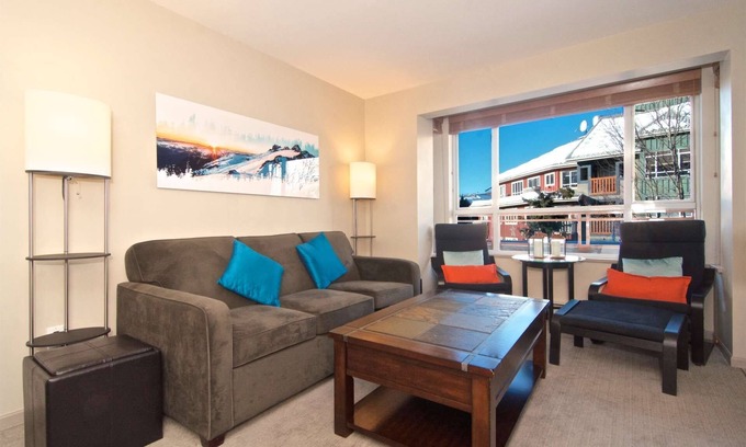 Village North Condo | Relax and Watch the activity of the Village on the oversized patio. Professionally Managed.