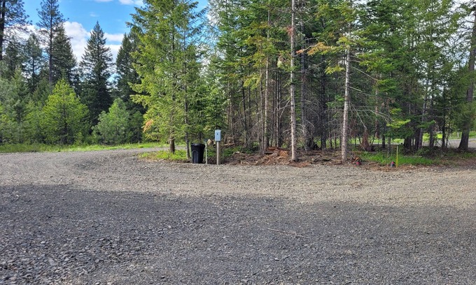 Harvard RV Rental | Remote RV site with full hookups on 16 wooded acres. Site B.