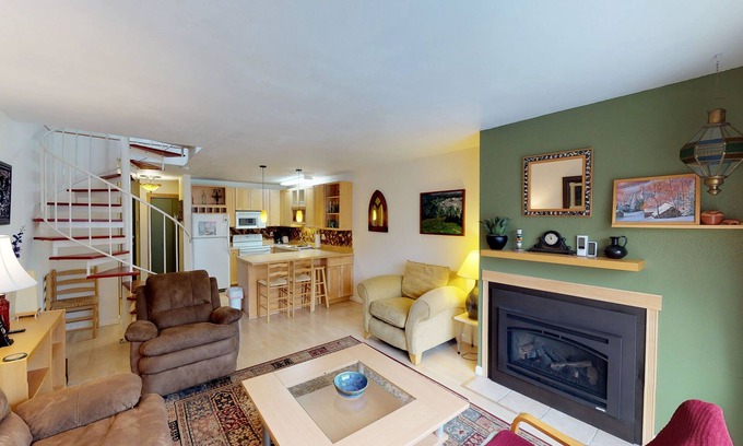 Alyeska Condo | Renovated condo with mountain views, fireplace & spiral staircase - walk to lift