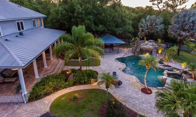 Greater Northdale House | Resort style pool with lazy river, grotto, and hot tub! Dog-Friendly!