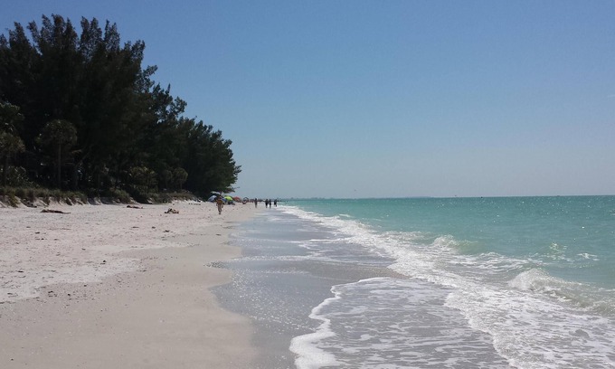 Sunset Beach Condo | Right on the Gulf! Beautiful white sandy beachfront! Safe, quiet, and friendly!
