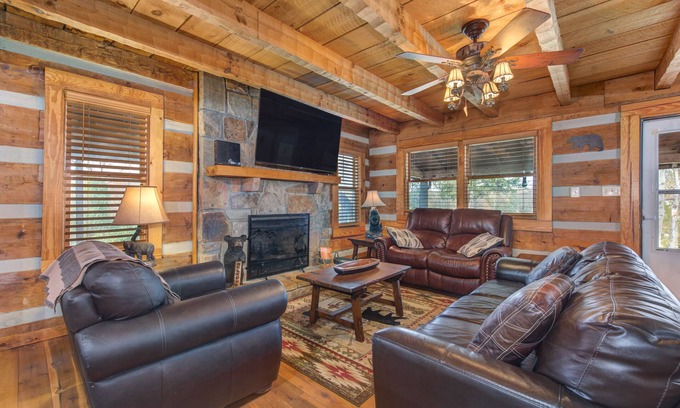 Sevierville Cabin | River-View Home w/Multi-Level Deck, Yard, Hot Tub, & Free Attraction Tickets