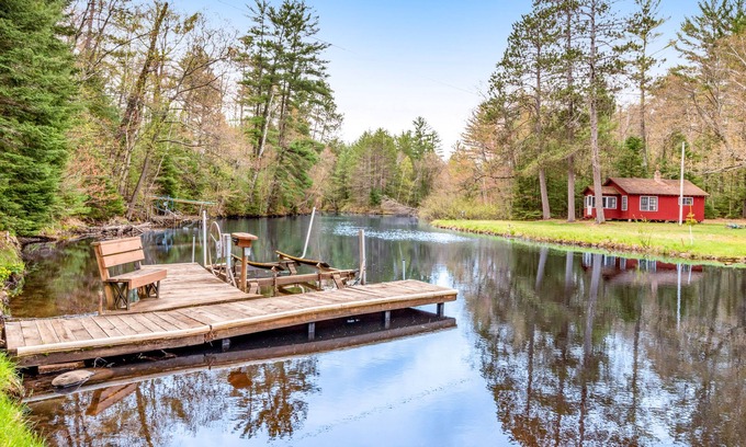 Eagle River House | Riverfront home with private dock, kayaks, views, firepit, cornhole & foosball
