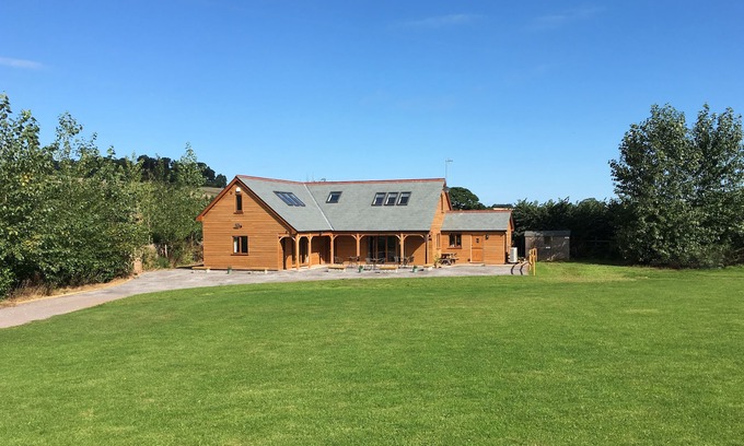 Old Cleeve Cottage | RIVERSIDE LODGE, pet friendly, with a garden in Washford