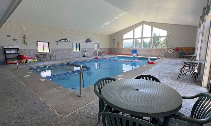 Alger House | Riverside Romance: Couple Getaway with Cozy Tavern Dining & Indoor Pool Access