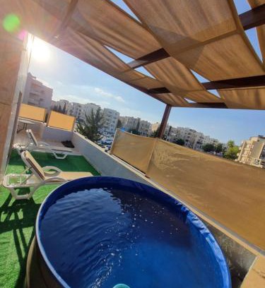 Amman Apartment | Rooftop pool with terraces F-R