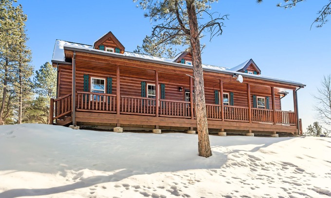 Florissant Cabin | Rural Wood Cabin Surrounded by Trees with WiFi, W/D, & Gorgeous Deck