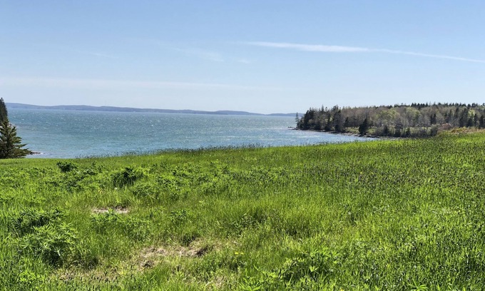 West Tremont House | Rustic vintage cottage in Duck Cove with limited ocean view.