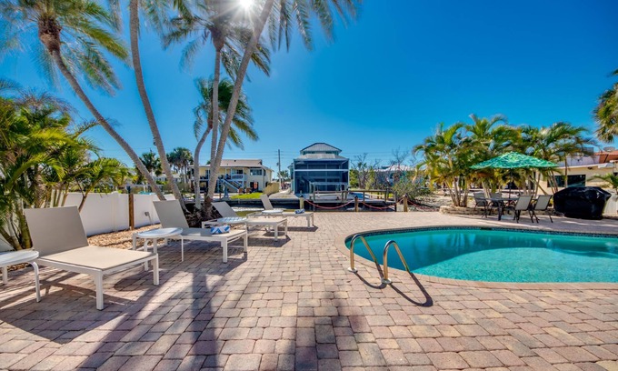 South Island House | Sand Dollar #2 - Downstairs Apt w Shared Pool on Canal by the Beach!
