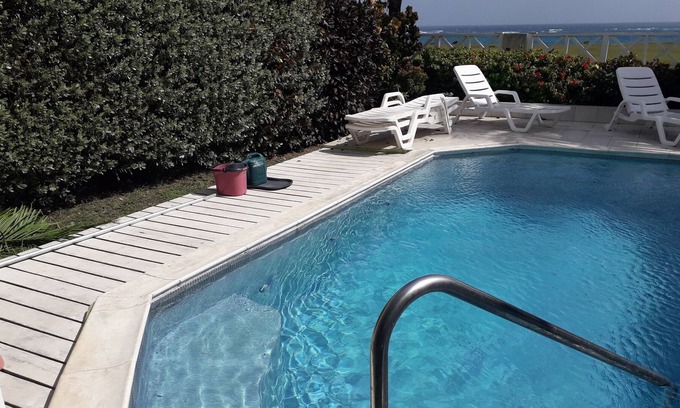 Bottom Bay House | Sea view with pool. Beautifully decorated throughout