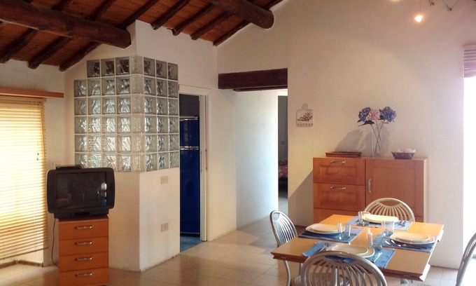 Santa Teresa di Gallura Apartment | Seaview cozy penthouse 300m walk to the beach, large terrace. Center Village.