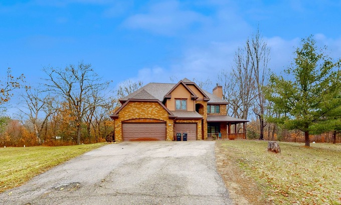 New Lisbon House | Secluded exclusive brick home with game room, fireplaces, large porch, firepit