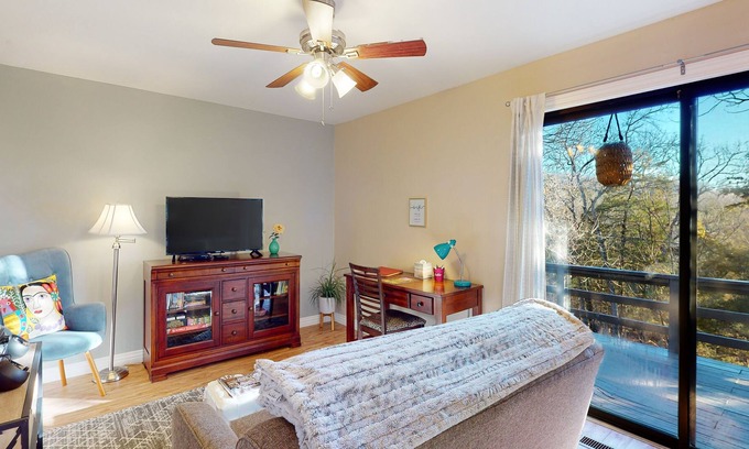 Holiday Island Condo | Secluded home near lake with a deck, wooded views & WiFi