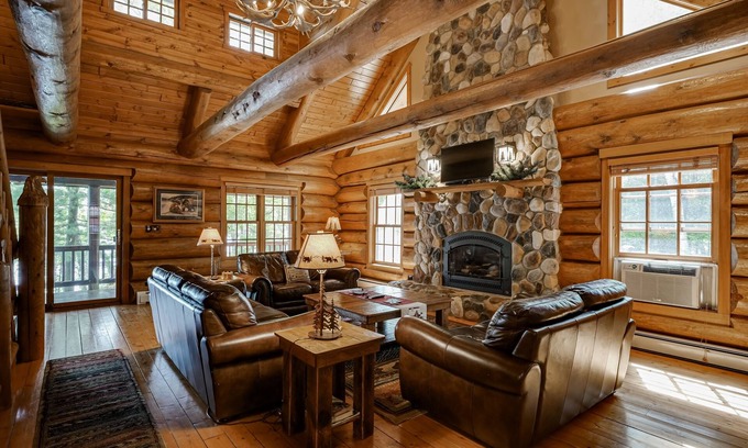 Eagle River House | Secluded waterfront log cabin with game room, dock, fire pit & deck