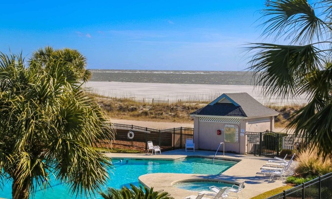 Isle of Palms Condo | See, Feel & Hear the Ocean from this Light-Filled Condo w/Community Pool & Private Screened Porch.