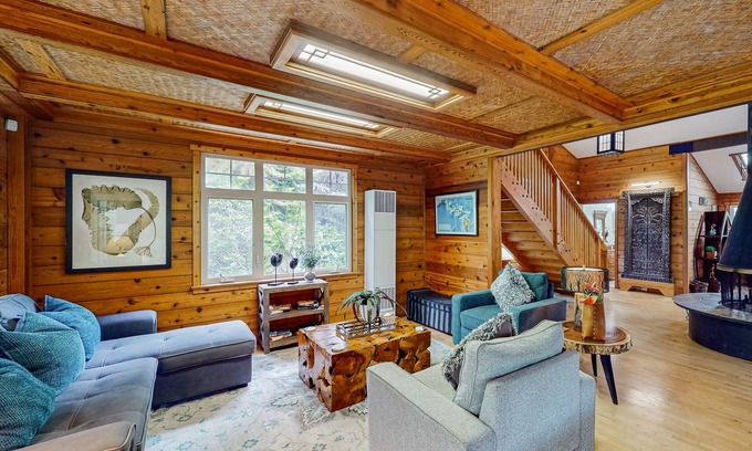 Volcano House | Serene 5-acre tropical hideaway with lanai and circular wood-burning fireplace