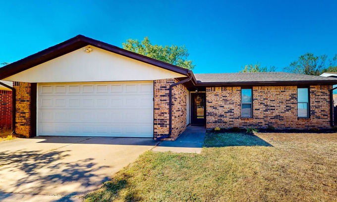 Stillwater House | Single-level home near OSU campus with fenced yard, patio, & grill