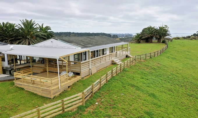 Awhitu Apartment | Sky tower and Water view over looking Paddock