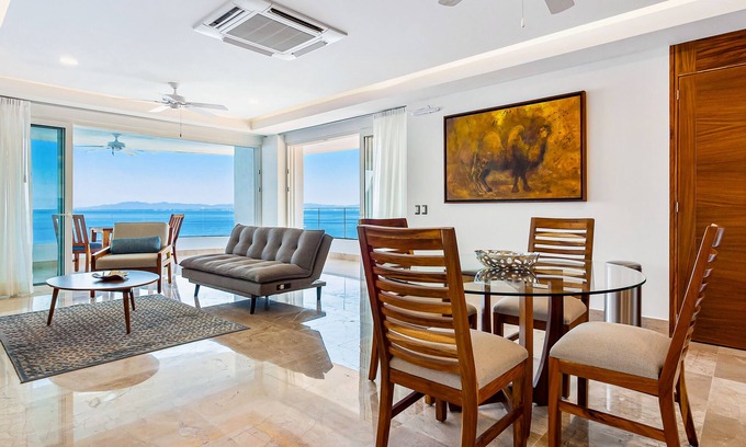 Mismaloya Condo | Sleek 9th-floor condo with wraparound balcony, ocean views & pool