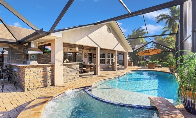 Fort Myers House | Southern Exposure with a Heated Pool/Spa, Standup Arcade on a Gulf Access Canal