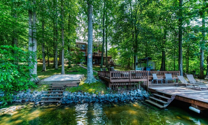 Blue Water House | Spacious lake lodge with a private dock, wraparound decks & foosball