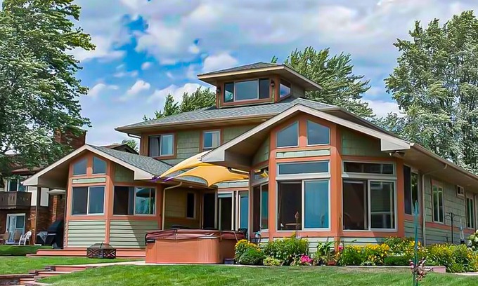 Paw Paw Lake House | Spacious lakefront home with a hot tub, private beach, washer/dryer, & AC