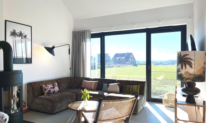 Hohwacht Apartment | Spacious, light-filled loft with rooftop terrace and fireplace.
