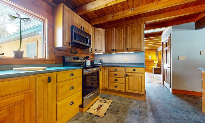 Chester House | Spacious retreat with private hot tub, game room, deck, fireplace, & W/D