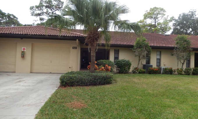 Sarasota Condo | Spacious Well Appointed Property, view across pond within a lovely community