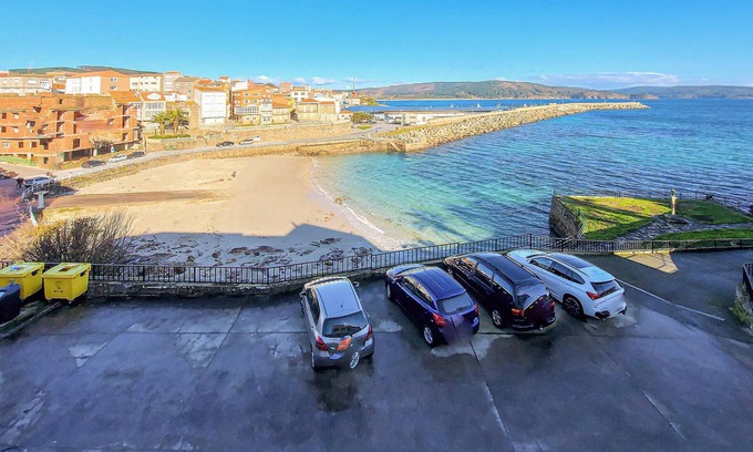 Fisterra Apartment | Spend a relaxing time out in this vacation apartment right by the sea.