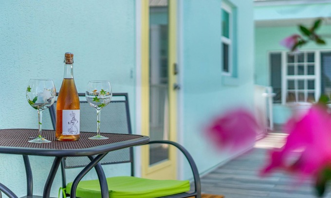 New Smyrna Beach Condo | Stay ON Flagler Avenue! Charming Condo with Full Kitchen, Parking and Courtyard!