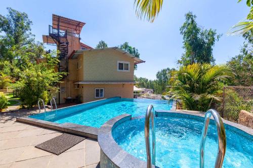 Nandanwan Villa | StayVista's Chimney Cottage with Sprawling Lawns, Picturesque Views, Plunge Pool, Jacuzzi, and Home Theatre