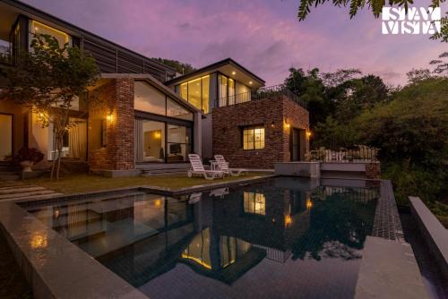 Bedla Villa | StayVista's Ikebana - Living By The Forest Edge - Mountain-view Villa with Infinity Pool, Lawn, & Indoor-Outdoor Games