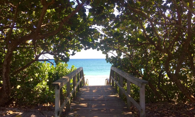 Juno Beach House | Steps to the Beach. Prime Location. Beach Bungalow Chic.