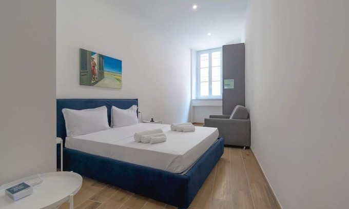San Donato - Campidoglio Apartment | Studio apartment with double bed, armchair bed and equipped kitchenette.