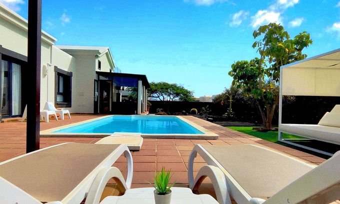Playa Blanca Villa | Stunning detached villa with sea view, beautiful landscaped gardens, A/C & wifi