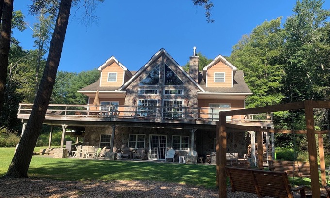 Blakeslee House | Stunning Lake Front Home, Near Ski Slopes, Fireplace, Hot Tub, Firepit, Boats