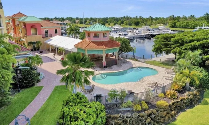 Cape Harbour Condo | Stunning Sunset Views * Steps away from fine dining, marina, live music, & more.