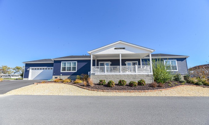 Long Neck House | Stunning waterfront home, beach, pools, pet friendly!