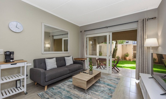 Sandown Apartment | Stylish Garden Retreat w/Pool and Modern Amenities