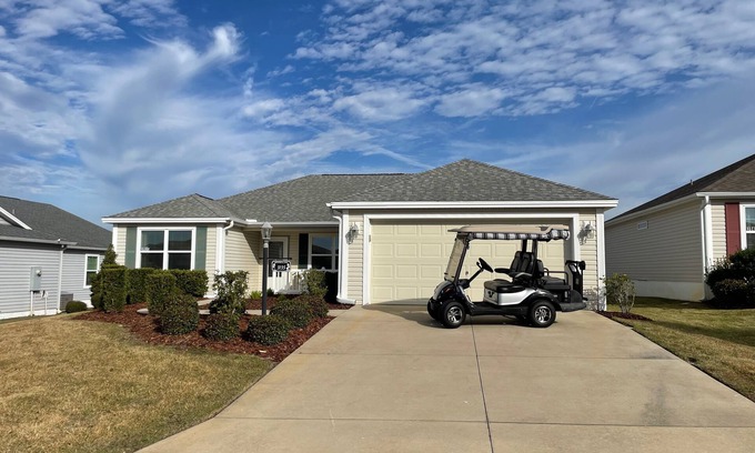 Fruitland Park House | Stylish Home with Golf Cart, Lanai & Prime Location Near Town Squares!