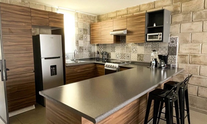 Downtown Guadalajara Apartment | Stylish urban loft with access to gym and work rooms.