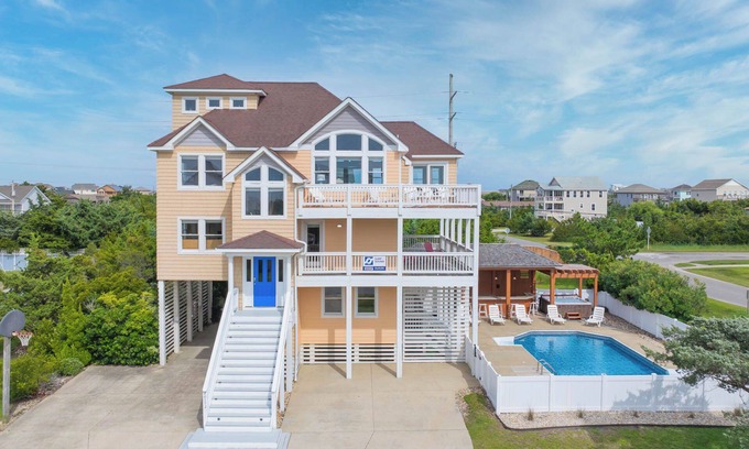 Wind Over Waves House | SUMMER SAVINGS - Soundside Dog Friendly Home with Pool, Hot Tub, and Game Room