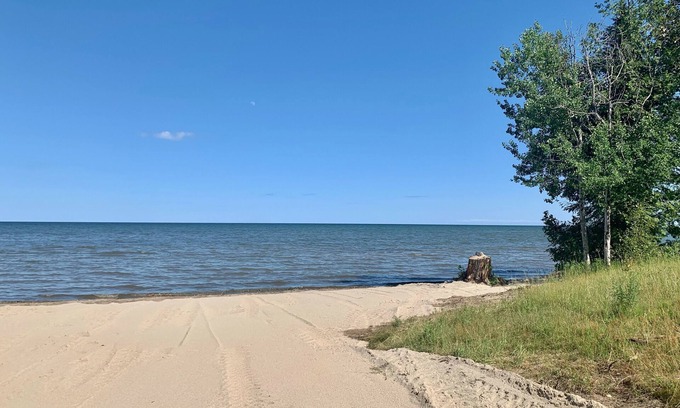 Escanaba House | Sun Rise Shores. Private. Hot tub over looking Lake Michigan.